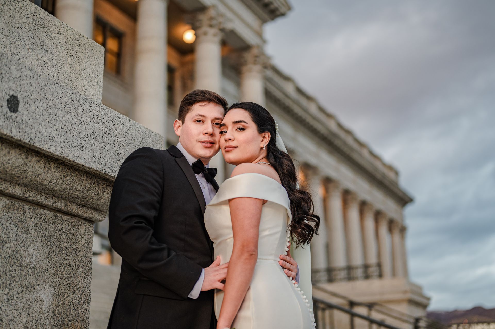 Bride and groom sharing a romantic, intimate moment outdoors
