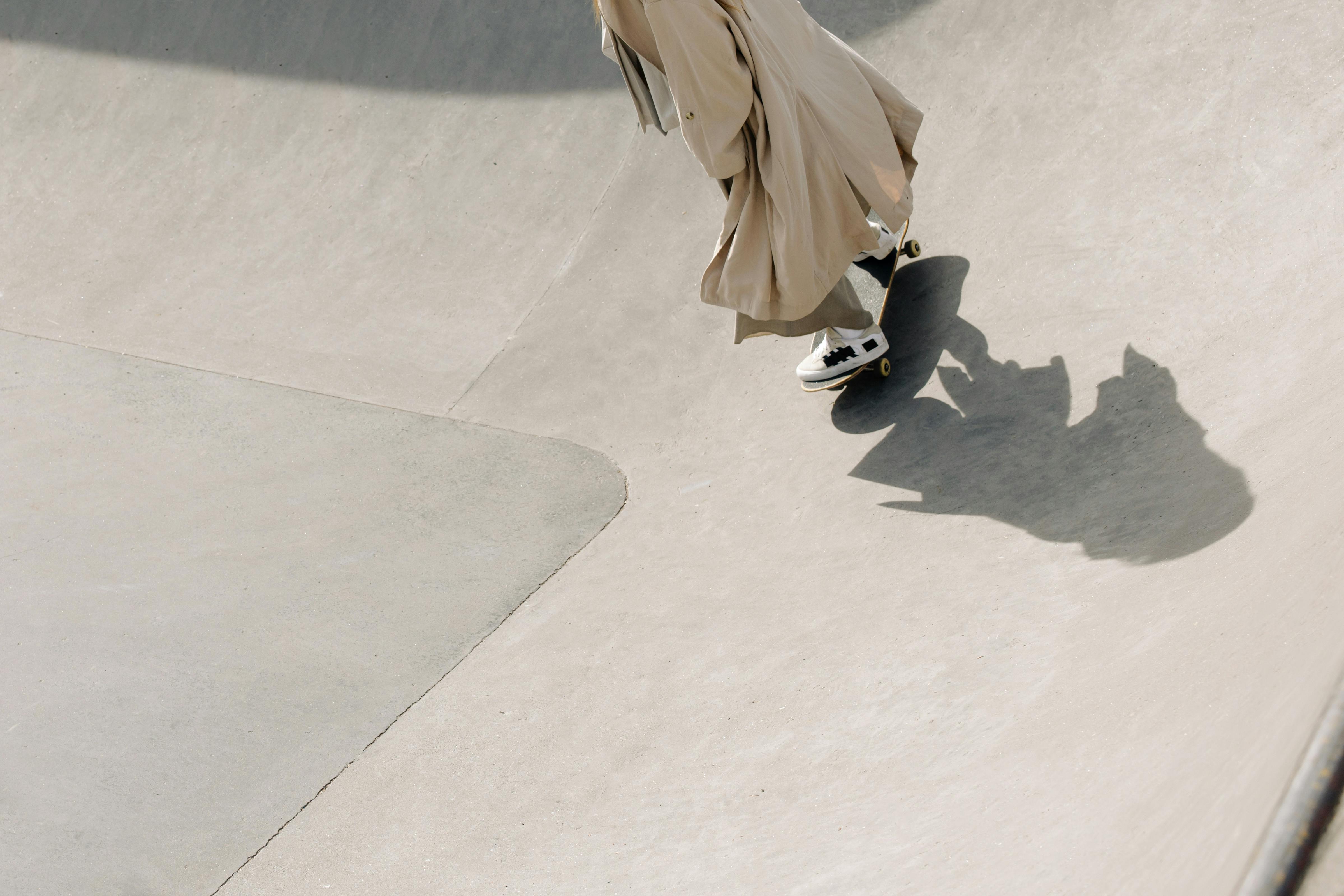 shadow of a person skateboarding in a skatepark