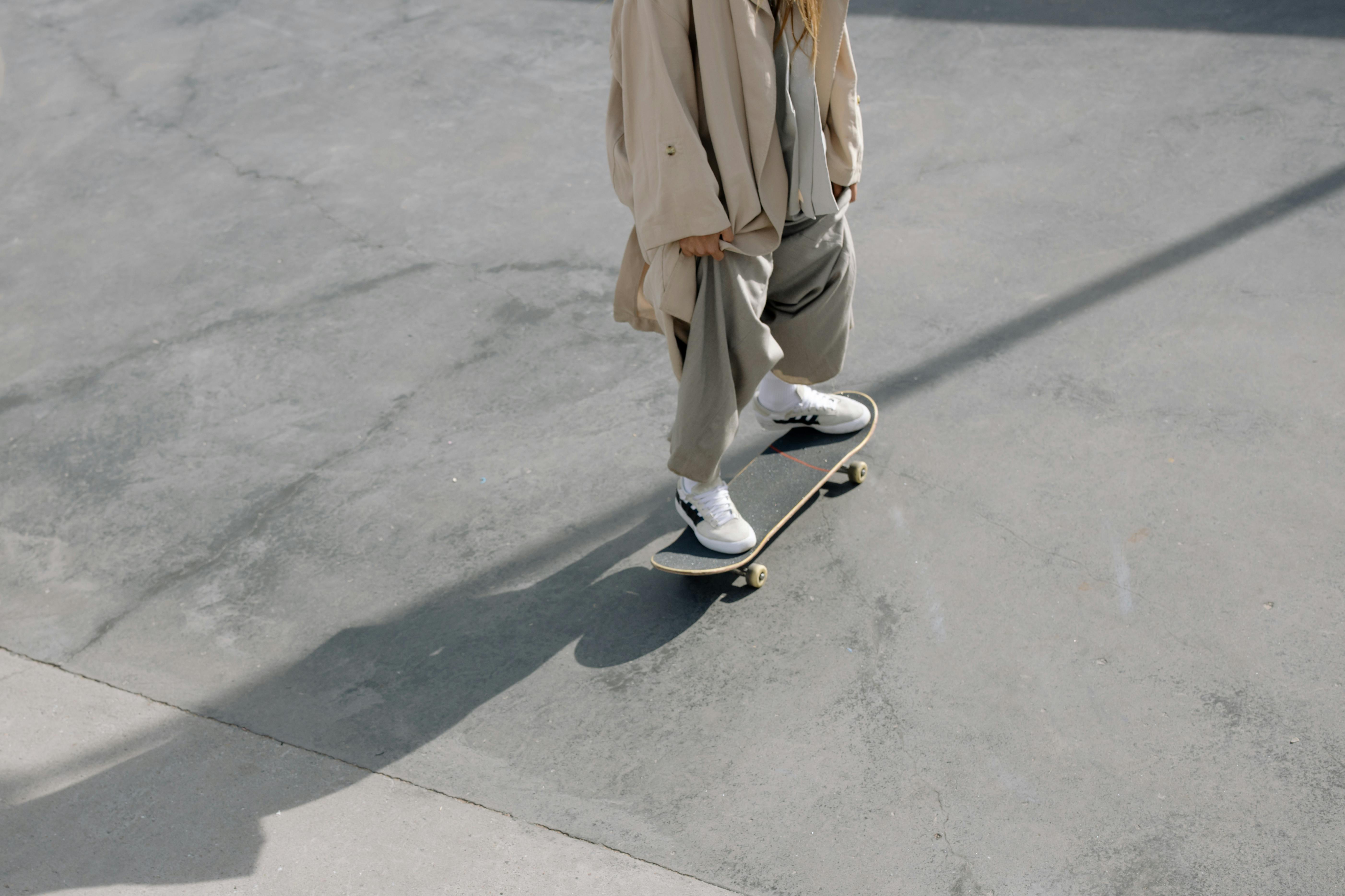 Woman in Black Shirt and Pants Holding Skateboard during Daytime · Free ...