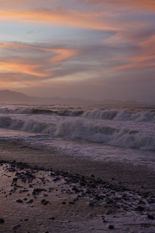 Sea Waves on the Sea Shore under Twilight Sky