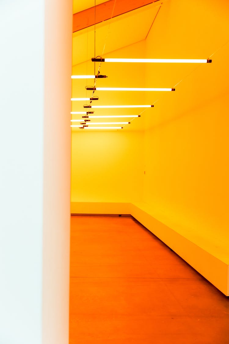 Narrow Hallway With Yellow Painted Wall