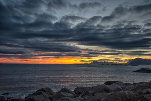 Gray Rock Formation on Seashore during Sunset