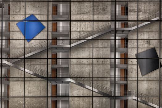 Industrial style with geometric art on a Berlin building facade.