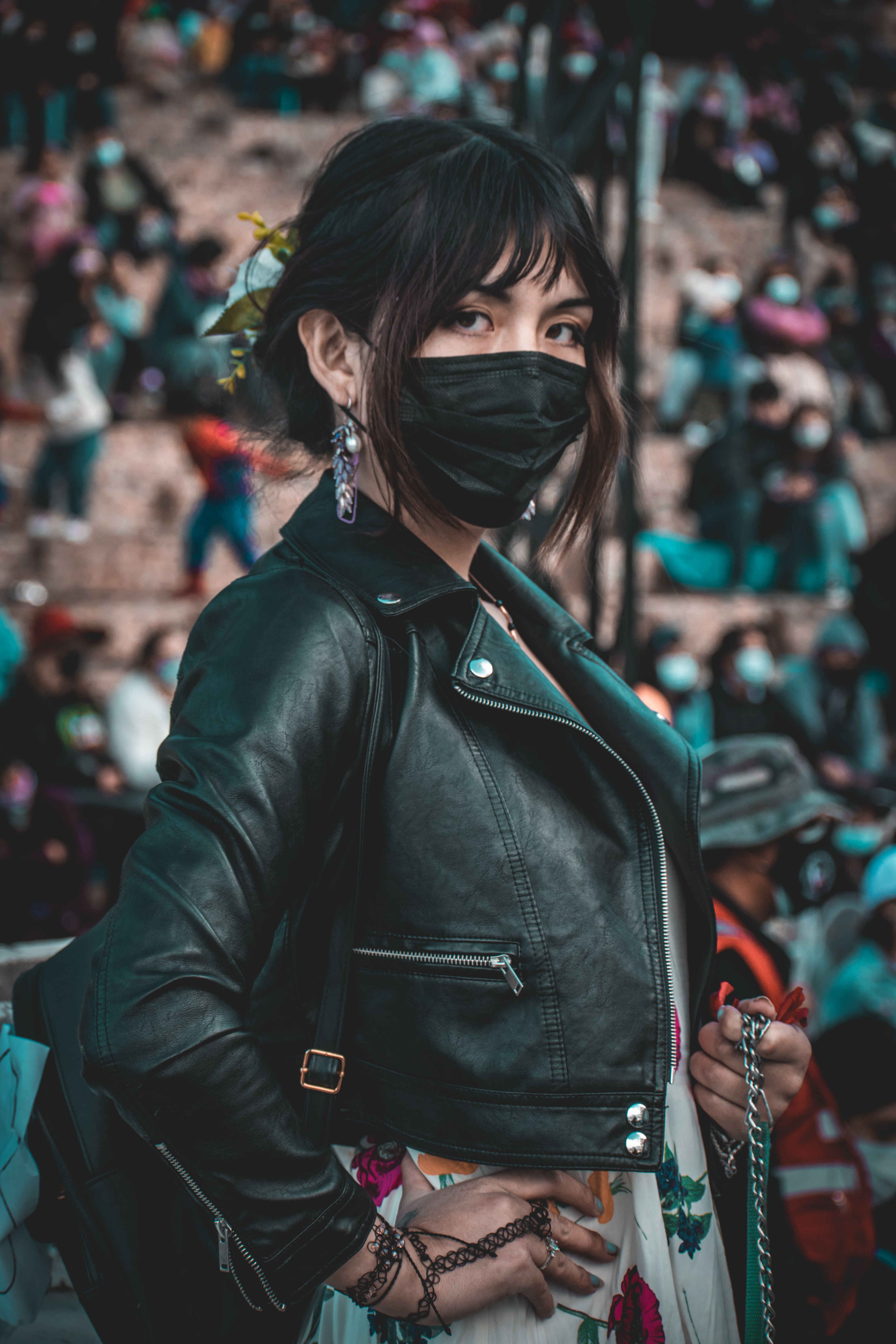 A Woman in Black Leather Jacket Wearing Face Mask · Free Stock Photo
