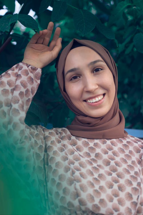 A Smiling Woman Wearing Brown Headscarf