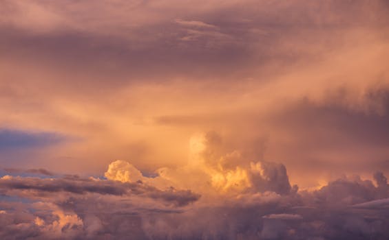 Stunning cloudscape captured at sunset, showcasing vibrant hues and dramatic clouds.