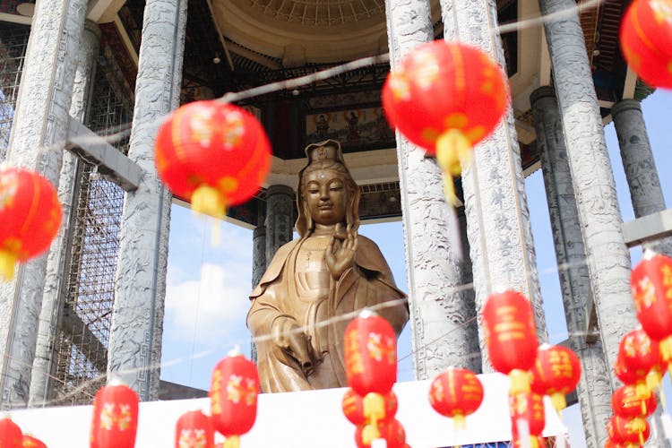 A Statue In A Shrine