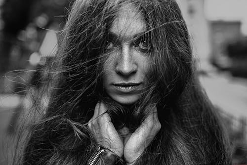 Grayscale Photo of Woman with Messy Hair