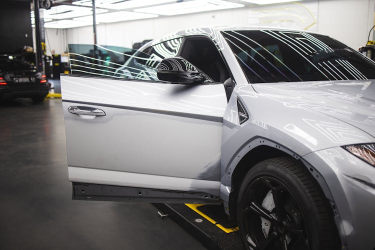 A Gray Car Undergoing Repair Services