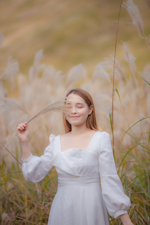 Selective Focus of a Girl Holding Pampas Grass 