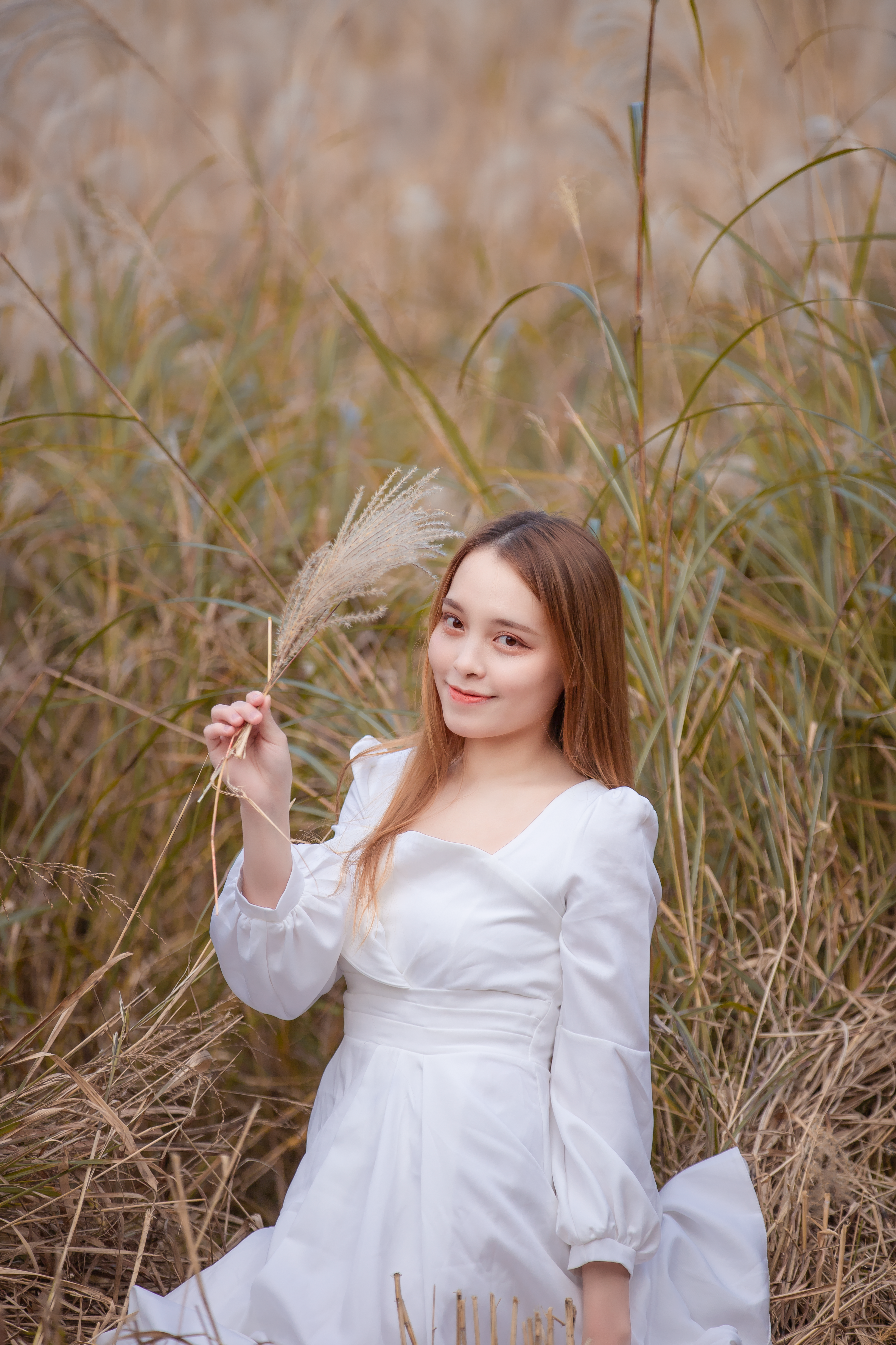 Woman in White Long Sleeve Dress Holding Wheat · Free Stock Photo