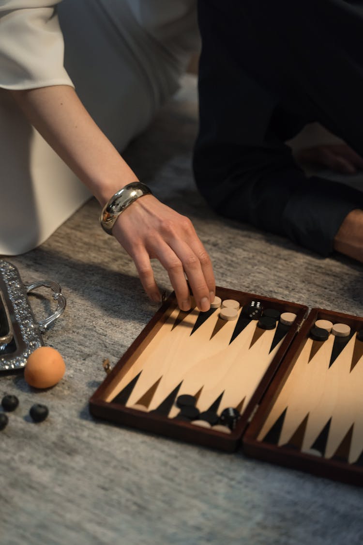 Person Playing Backgammon