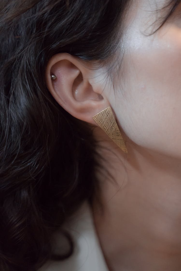 Close-up Of Ear With Triangle Shaped Earring