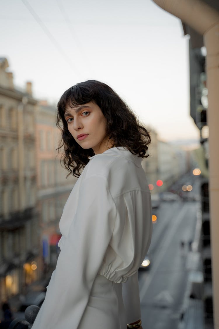 Bohemian Young Woman Standing On Balcony