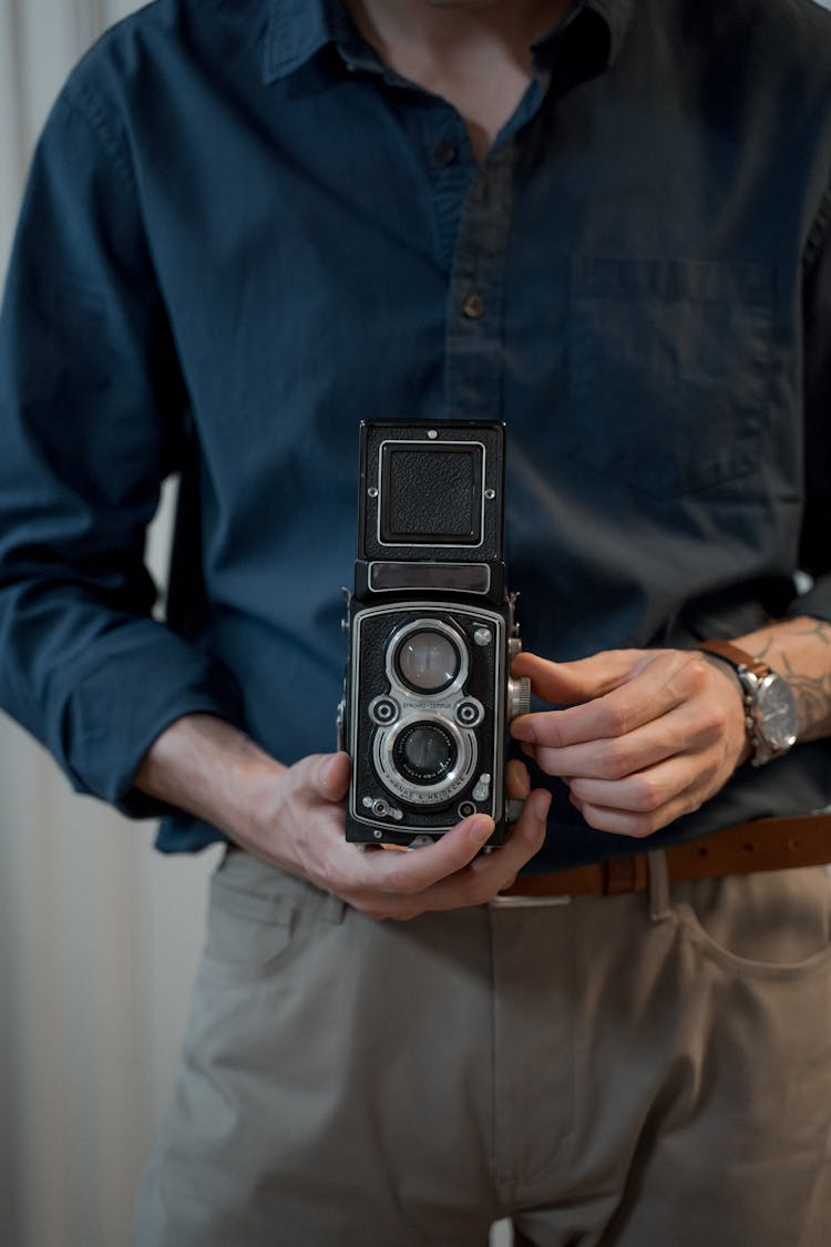 Midsection Photo Of Man Holding Analog Camera