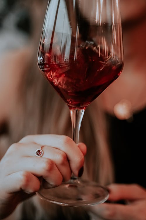 A Person Holding a Wine Glass