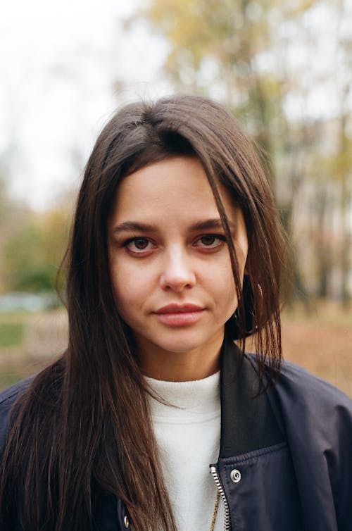 Pretty Teenage Girl Seriously Looking at Camera