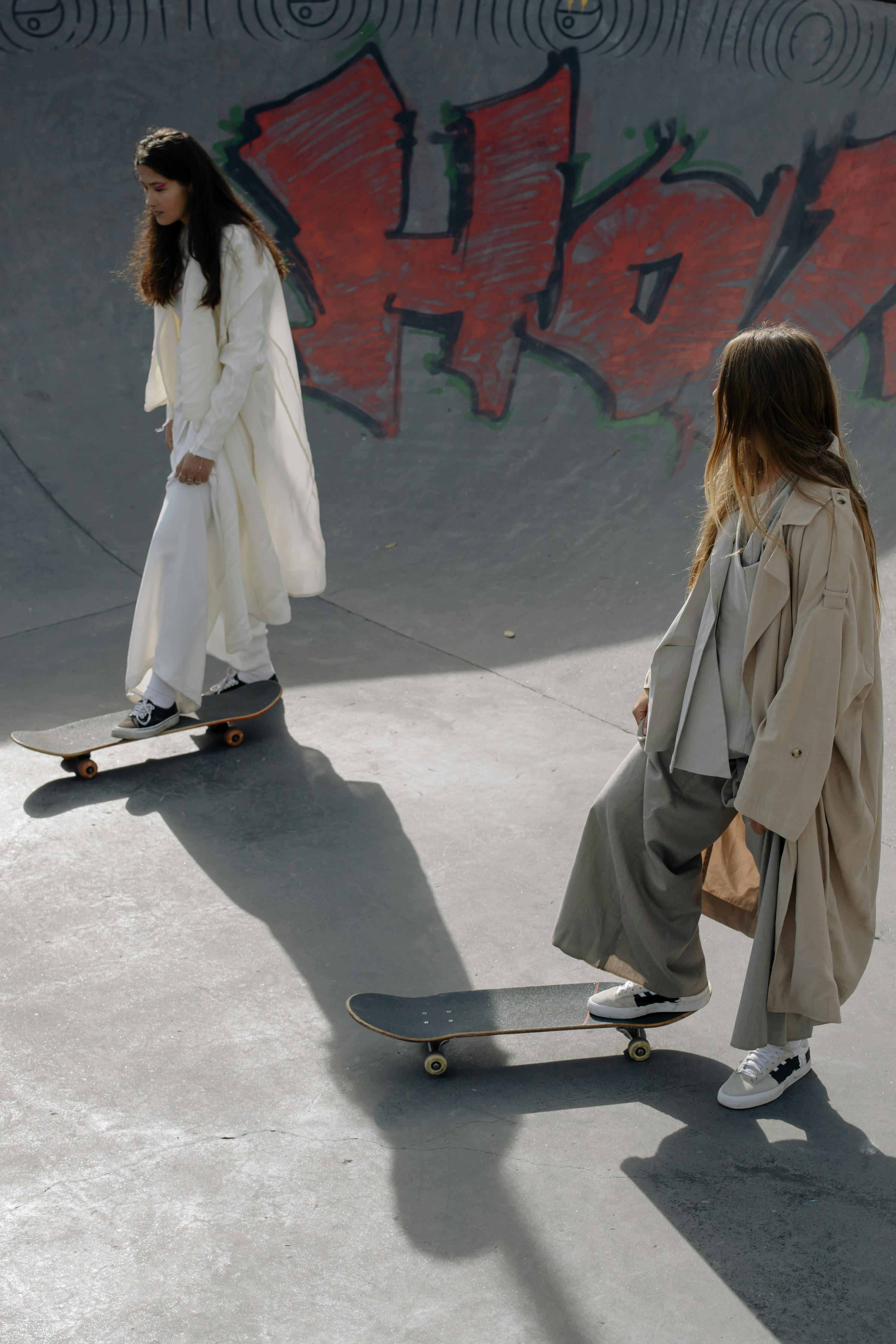 women skateboarding in a skatepark