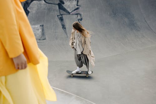 Woman Skateboarding at Skate Park