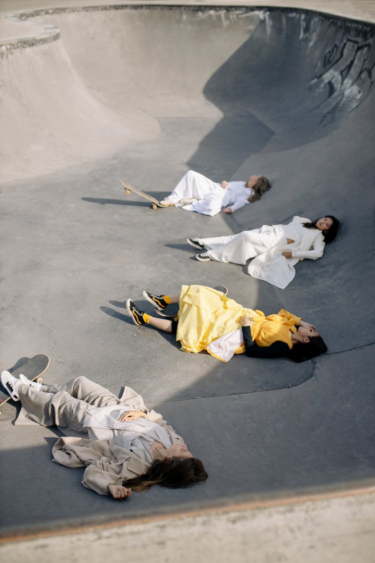 Women Lying On A Skate Ramp