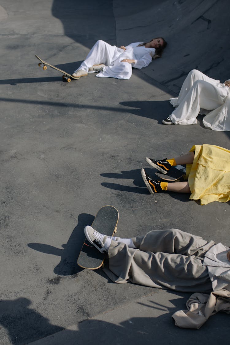 People Lying On A Skate Ramp