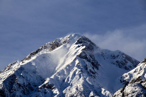 Free Majestic snow-covered peaks of the Thaur mountain range in Tyrol, Austria during winter. Stock Photo