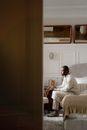 Man Sitting in an Armchair and Looking ahead