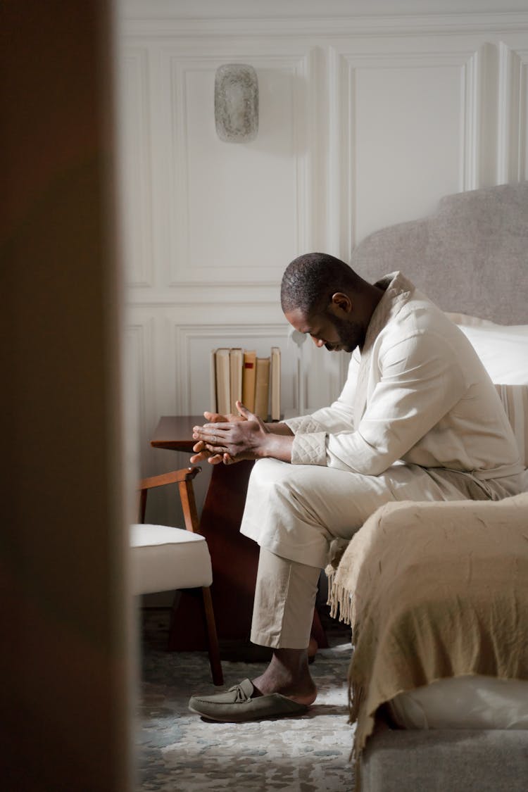 Man Sitting In A Bathrobe In An Armchair