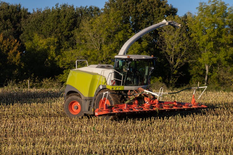 A Tractor Plowing The Field