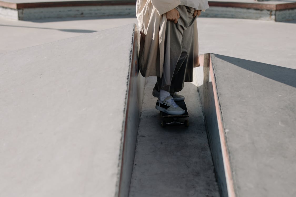 A Person Riding a Skateboard in a Skate Park · Free Stock Photo