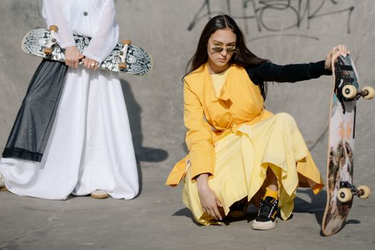 Woman in Yellow Dress Sitting on Gray Concrete Floor