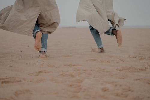 Free Men Running on Beach  Stock Photo