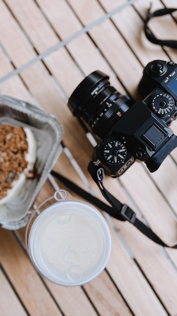 Breakfast And Camera On The Table