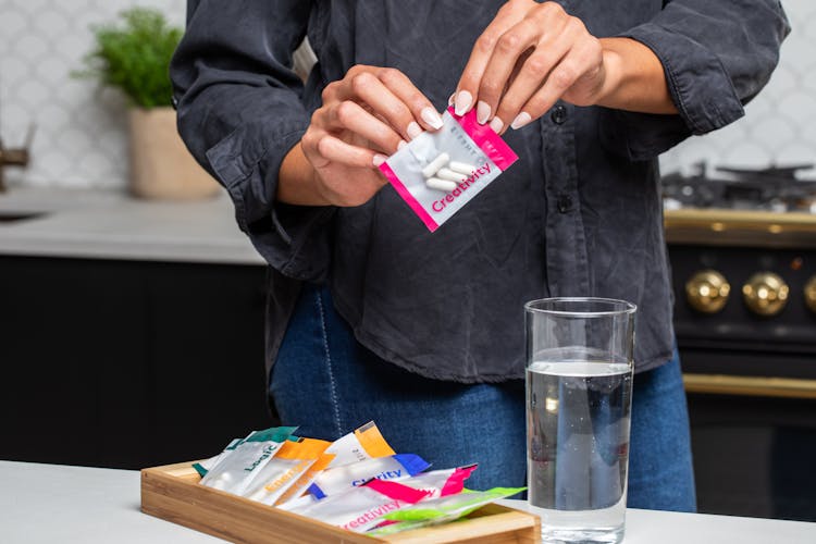 A Person Holding A Pack Of Pills With A Label Creativity