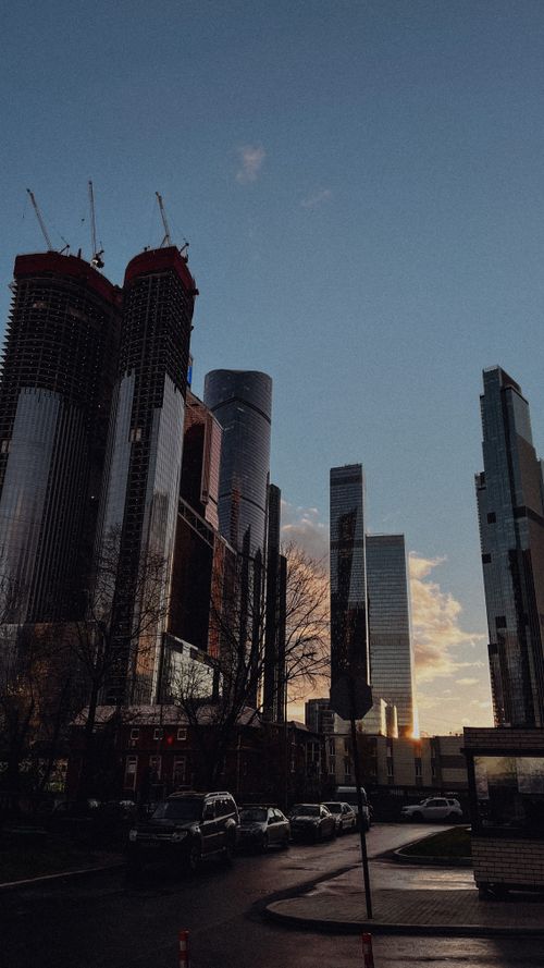 Free Captivating view of Moscow City skyscrapers during sunset with a warm golden hour glow. Stock Photo
