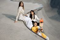 2 Women in White Coat Riding on Black and Yellow Inflatable Boat