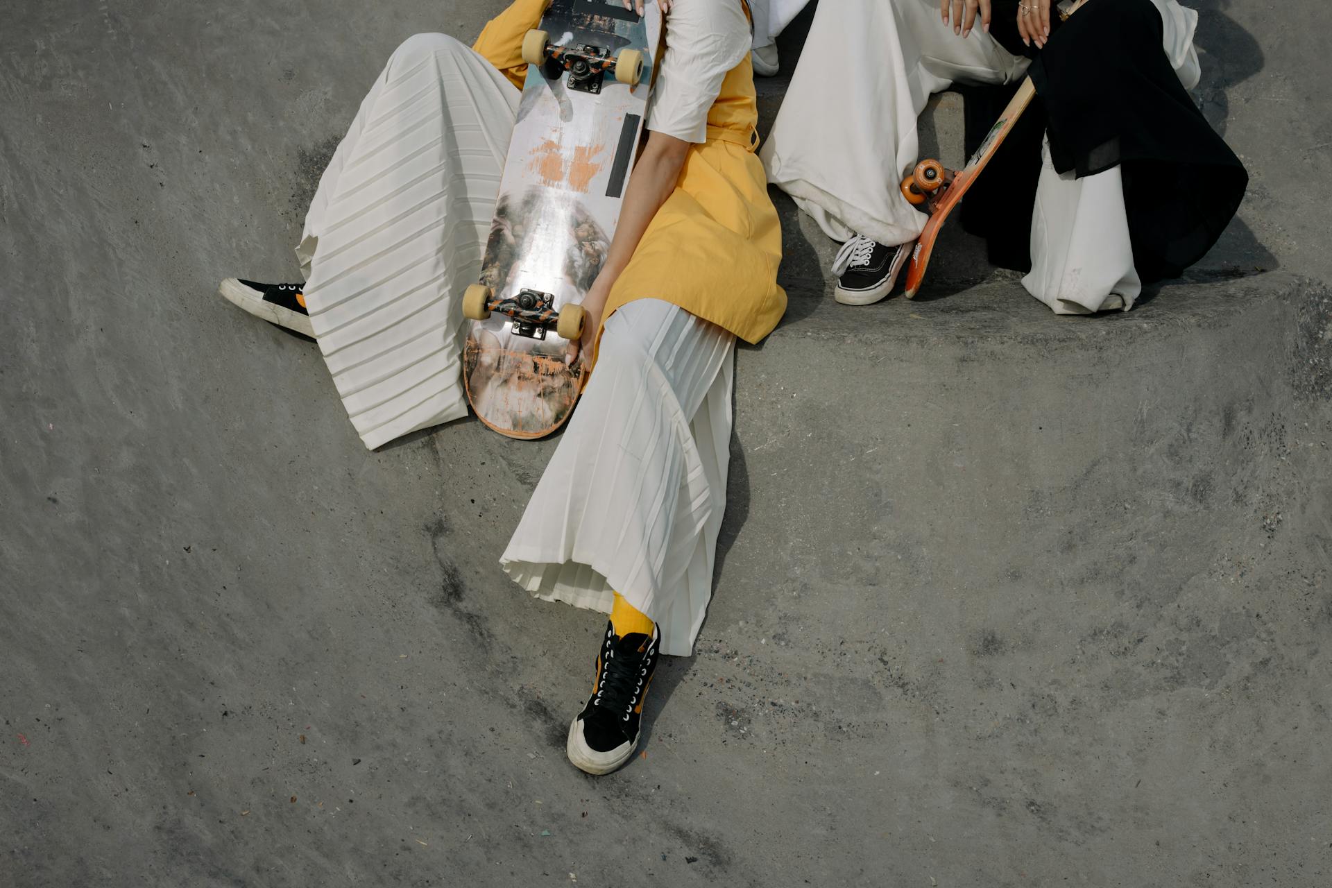 Skateboarders Sitting on a Ramp