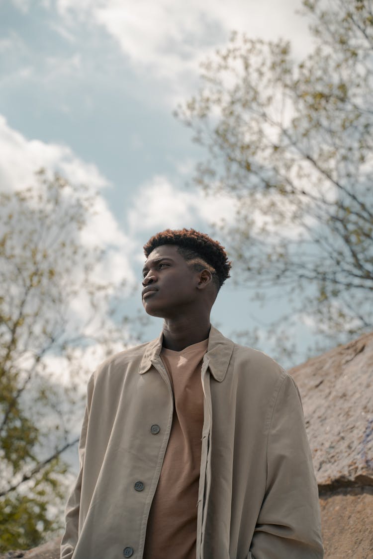 Man Standing Among Trees Looking Around