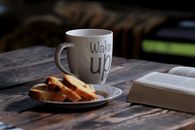 Breakfast on the Table Near a Book