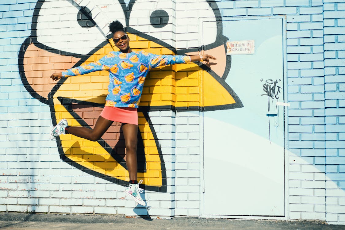 Girl In Blue Sweatshirt And Pink Skit In Jumpshot Photo