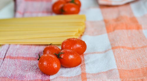 Pasta and Fresh Tomatoes on a Tablecloth