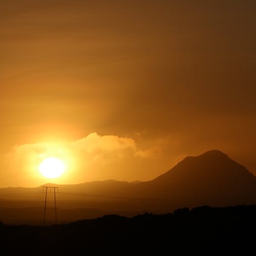 Silhouette of Mountain During Golden Hour 