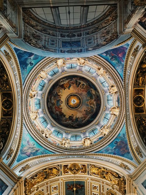Free A beautifully detailed dome ceiling inside a cathedral showcasing exquisite religious art and architecture. Stock Photo
