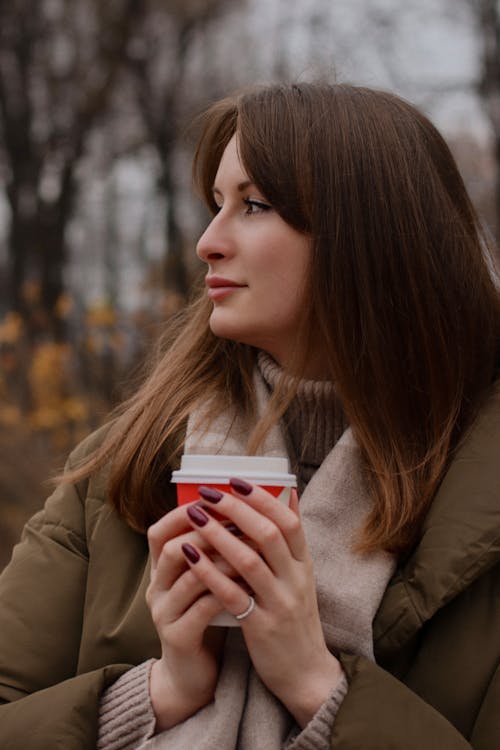 Woman Holding Coffee Outdoors