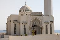 Front view of the Ibrahim-al-Ibrahim Mosque in Gibraltar against a clear sky.