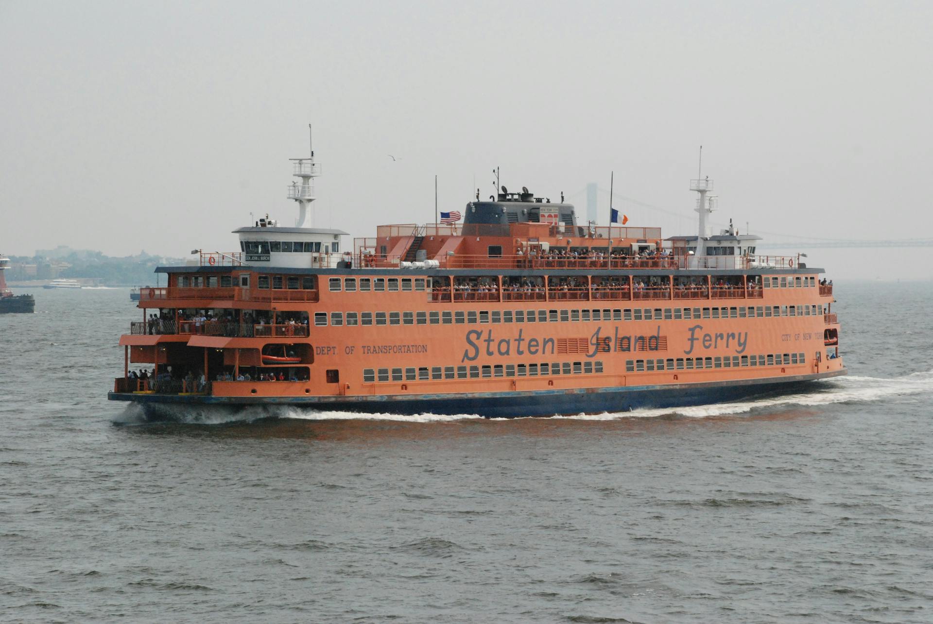 Iconic Staten Island Ferry cruising through New York City's waterways. Ideal for travel enthusiasts.