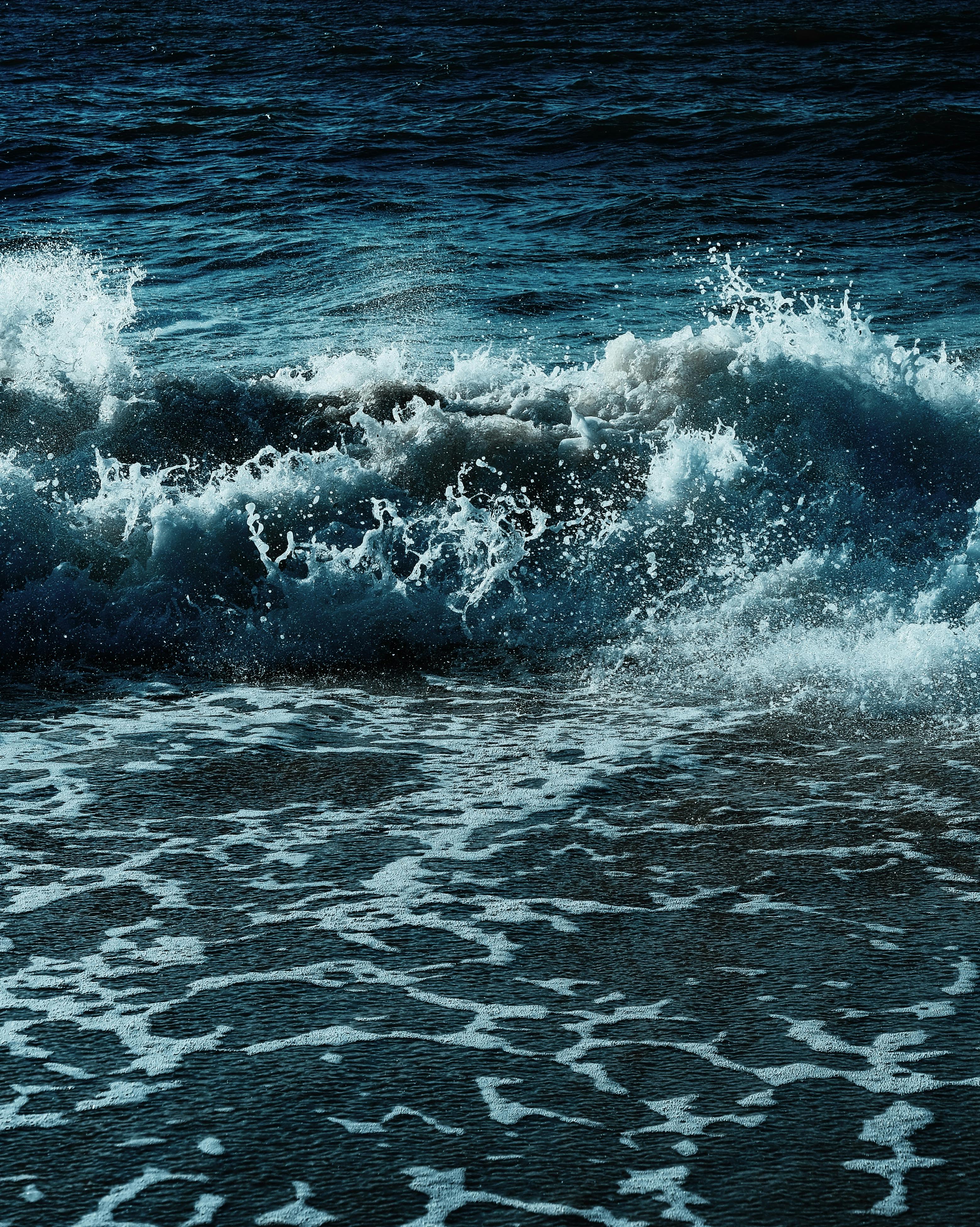 Powerful ocean waves crashing on the Kaliningrad Oblast shoreline, showcasing the sea's dynamic energy.