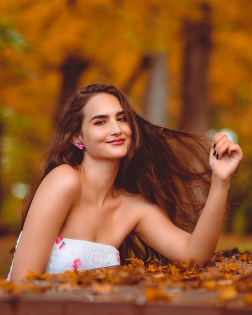 A Beautiful Woman in White Tube Top Smiling