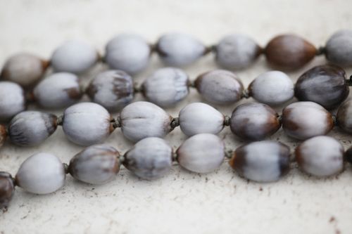 Free Detailed view of frosted gray and brown beads arranged in rows. Stock Photo