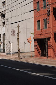 A city street view showcasing unique red brick architecture and urban landscape.